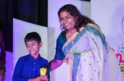 Receiving Prizes - Onam Celebration
